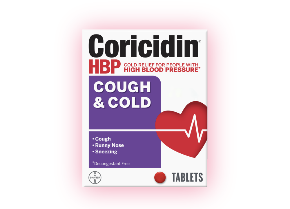 Pack of Coricidin® HBP Cough & Cold medicine with the label which says that it provides cold relief for people with high blood pressure* and relieves cough, runny nose, and sneezing. The pack features a red heart with a heartbeat line and a red tablet icon. The text on the pack also says that it's a *Decongestant free medicine.